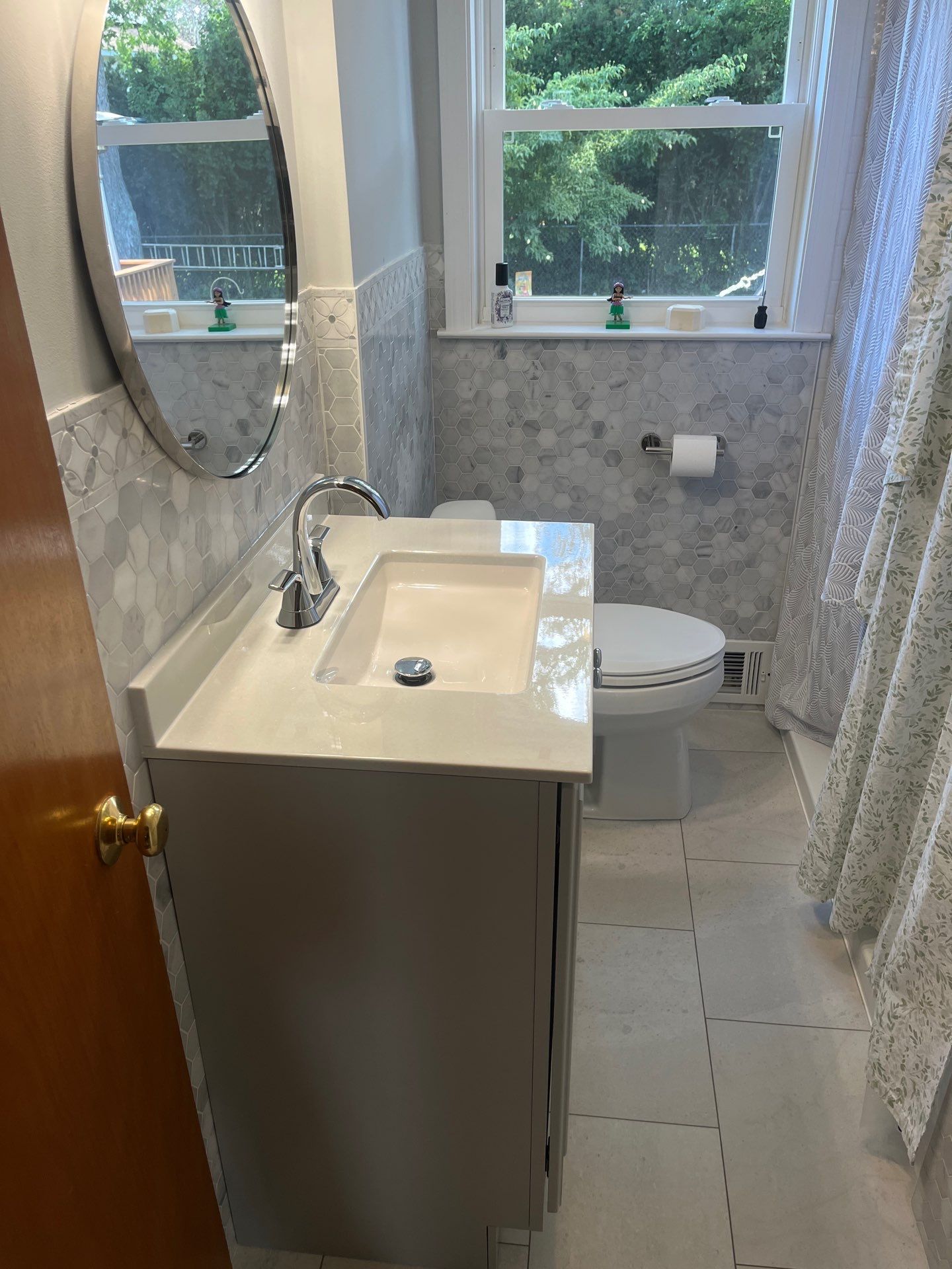 A welcoming light-color themed full bathroom remodel in Plymouth, MA.