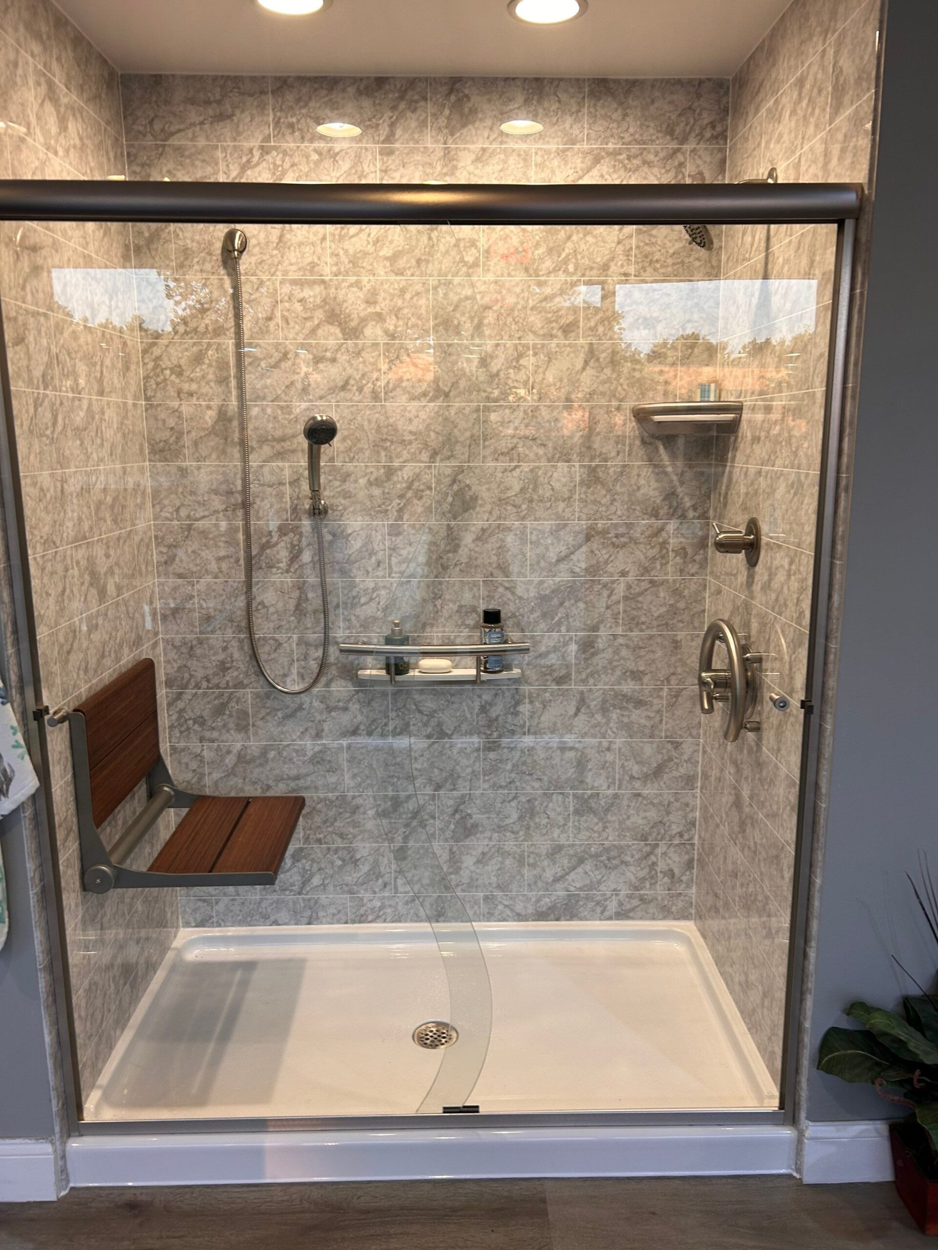 A small space layout with a black framed tub-to-shower conversion in Plymouth, MA.