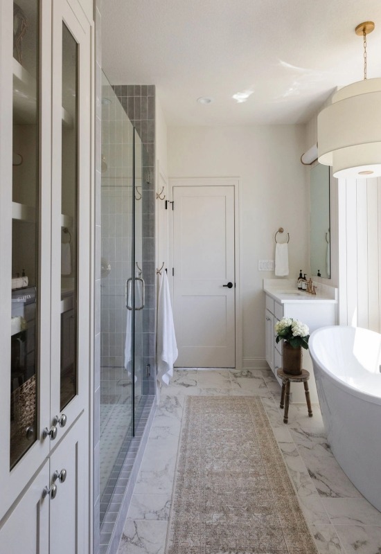 Large, remodeled bathroom with a stylish shower area and a luxurious bathtub in Weymouth, MA 