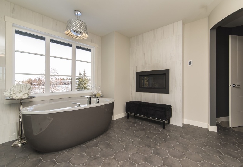 A stylish bathroom featuring a large tub and elegant tiles in Peabody, MA